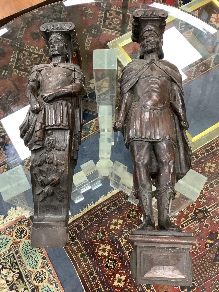 A 19th century pair of figural carvings